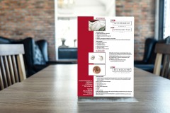 Blank screen mock up menu frame standing on wood table in coffee cafe and restaurant background