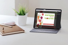 Mockup blank screen tablet with keyboard on white top table.